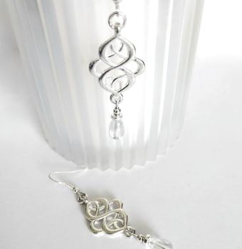 Handmade earrings, created with silver plated celtic knots, silver plated beads and iridescent clear glass drops. They are suspended from silver plated, nickel free ear wires, suitable for sensitive ears. Lightweight, comfortable to wear and very versatile.. Elevate your style with these gorgeous bespoke pieces.. They arrive in a pretty organza bag, and have free shipping.
