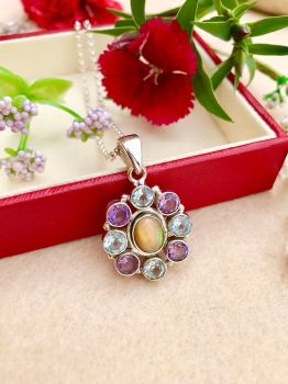Genuine Ethiopian Opal, Amethyst and Blue Topaz Sterling Silver Necklace
Metal: Sterling Silver
Gem: Ethiopian Opal, Amethyst, Blue Topaz
Opal size: 8.5mm x 6.5mm