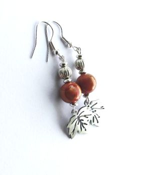 Beautiful autumnal earrings, created with small highly polished stainless steel leaf drops, acrylic beads, silver plated beads and ear wires.. the ear wires are nickel free and suitable for sensitive ears. Gorgeous, lightweight and comfortable to wear, these bespoke earrings are perfect for Autumn&hellip; Enhance your look with these beauties&hellip; They arrive in a pretty organza bag, and have free shipping..