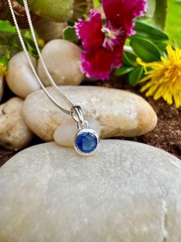 Brilliant round&nbsp;cut Blue&nbsp;Kyanite bezel set in Silver Necklace&nbsp;
Metal: Sterling Silver&nbsp;
Gem: Genuine Blue&nbsp;Kyanite
Stone Size: 5mm x 5mm