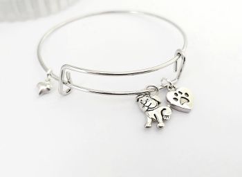 Gorgeous polished stainless steel adjustable bangle, with cute antique silver dog and paw charms, and a tiny silver plated heart charm... light and easy to wear and great for dog lovers! It arrives in a pretty organza bag, and has free shipping