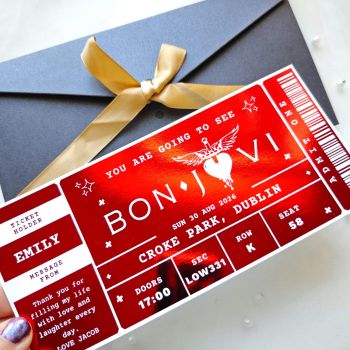 Turn your reveal into a moment to remember with a personalised foil concert ticket inspired by Bon Jovi. Handmade in County Cork by Printarelle, this keepsake is perfect for surprising someone with tickets, marking an anniversary, or gifting a fan a stylish memento.
Personalised Foil Ticket Features &amp; Handmade Details
Key Features


Customisable fields: recipient name, from name, date, venue, section/row/seat, message
Foil choices: red, gold, silver, rose gold, holographic
Premium heavyweight card with crisp, professional print
Includes eco-friendly kraft envelope
Handmade in Ireland; dispatched in 2&ndash;5 working days
