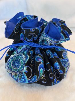 Each Jewellery Pouch is handmade from stylish cotton fabric which is fully lined and has a drawstring closure. There are 8 small pockets inside plus a main compartment to put larger pieces of jewellery.  These cute little pouches are perfect for carrying your jewellery when you’re travelling or even to store a few special pieces in your drawer at home. There are a variety of colours and designs to choose from. One to suit every taste.
If you wish to send this Jewellery Pouch to someone special you can add a personal note (in the “Note to vendor” option), which we will handwrite and enclose with your order. Just put their name and address in the shipping information and we’ll post it for you…. as easy as that!