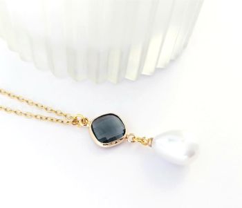 Handmade pendant, created with a beautiful gold framed faceted glass bead in graphite and a faux pearl drop, suspended from a stainless steel fine chain in gold. The drop on this pendant is approx. 3.8cm/1.5ins .. the chain is approx. 45.7cm/18ins in length, plus extension chain approx. 5cm/2ins. Lightweight, elegant and easy to wear.. Enchance your look with this beautiful piece… It arrives in a pretty organza bag, and has free shipping!