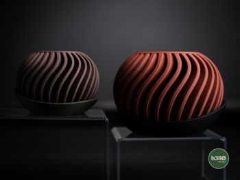 Meet the Surge Planter&mdash;where practicality gets a serious style upgrade. This eye-catching vessel features striking geometric patterns and sleek contours that transform any corner into a design moment. The integrated drip tray works quietly in the background, protecting your surfaces while your plants steal the spotlight. Crafted via 3D printing and designed by h3li&Oslash;, each planter is a one-of-a-kind creation tailored just for you. Why settle for ordinary when your greenery deserves something extraordinary?


Big size: 100mm height version&nbsp;&nbsp;
Small size: 80mm height version&nbsp;
