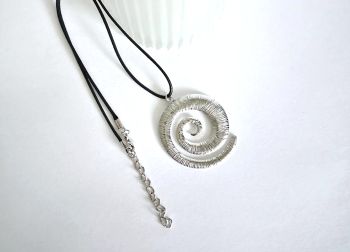A gorgeous polished stainless steel spiral pendant, made in Ireland with quality materials. Great for gifting, or a personal treat! It arrives in a pretty organza bag, and has free shipping.... the perfect excuse to add something special to your jewellery collection!