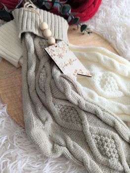 Add warmth and charm to your holiday tradition with our Custom Christmas Stocking With Name Tag. Carefully crafted to bring joy and personalization to your festive d&eacute;cor, these stockings are both beautiful and functional. Made from high-quality soft acrylic, these stockings are thick, durable, and elastic, with a double-sided classic knit pattern that holds its shape and adds a timeless charm to any space.