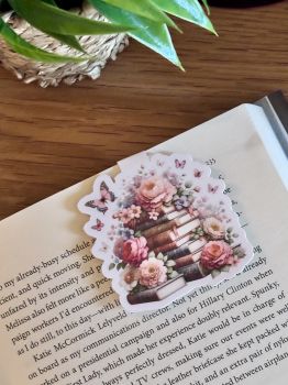 A beautifully detailed handmade magnetic bookmark featuring a vintage-style stack of books surrounded by roses, blossoms, and butterflies. A perfect gift for book lovers, floral lovers, and fans of romantic or vintage-inspired stationery.