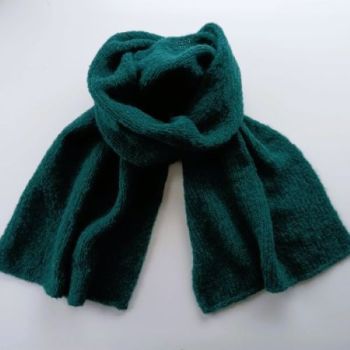 
Alpaca Wool &amp; Silk Scarves Ireland | Green
Green, our finest &nbsp;wool and silk scarves Ireland collection is hand knitted from an exclusive blend of alpaca Wool ( highest quality) and Silk yarn.(77% Alpaca &ndash; 23% Mulberry Silk).
Seriously soft and luxurious, you can wrap yourself up inside like in a cocoon.
This limited-edition collection offers a selection of timeless colours, reflecting the changing shades of the seasons &ndash; with pinks, heathers, rustics, greys, and greens.
A perfect gift for him or her -Beautiful with both formal and casual looks, this scarf elevates any outfit with a touch of quiet luxury &ndash; a timeless investment piece.
Colour: Green

Treasured for its unmatched softness, breathability and warmth.
Each scarf is hand knitted with love -a unique piece
Feels exquisite against the skin
Generous Size -One size fits all (170cm x 35cm.)
Perfect for chilly mornings or elegant evenings
Beautifully gift wrapped and ready for giving- from my studio in Dublin Ireland

&nbsp;