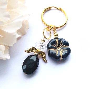 Handmade angel bag/key charm, created with a gorgeous faceted glass bead in black, a faceted crystal glass clear bead , gold plated beads, antique gold angel wings, and a czech glass flower bead in black and gold. It&rsquo;s suspended from a gold plated ring. A great gift for angel lovers! Perfect for stocking fillers&hellip;. It arrives in a pretty organza bag, and has free shipping!