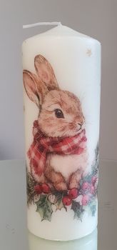 Bring festive charm to any space with this handmade bunny pillar candle. Standing 15cm tall with a 7.5cm diameter and 70+ hours burn time, it&rsquo;s perfect for creating a cozy atmosphere. Featuring a gorgeous bunny wrapped up in a scalf, this candle makes a beautiful gift or a treat for yourself. Each piece is&nbsp;crafted with love by Mariyas Creations, adding a touch of handmade magic to your home.