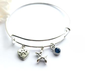 Gorgeous adjustable bracelet in polished stainless steel, with a cute &lsquo;balloon dog&rsquo; charm, a paw heart charm and a faceted glass bead in cornflower blue&hellip;. a lovely lightweight bangle, perfect for dog lovers! A great stocking filler for Christmas! It arrives in a pretty organza bag, and has free shipping!