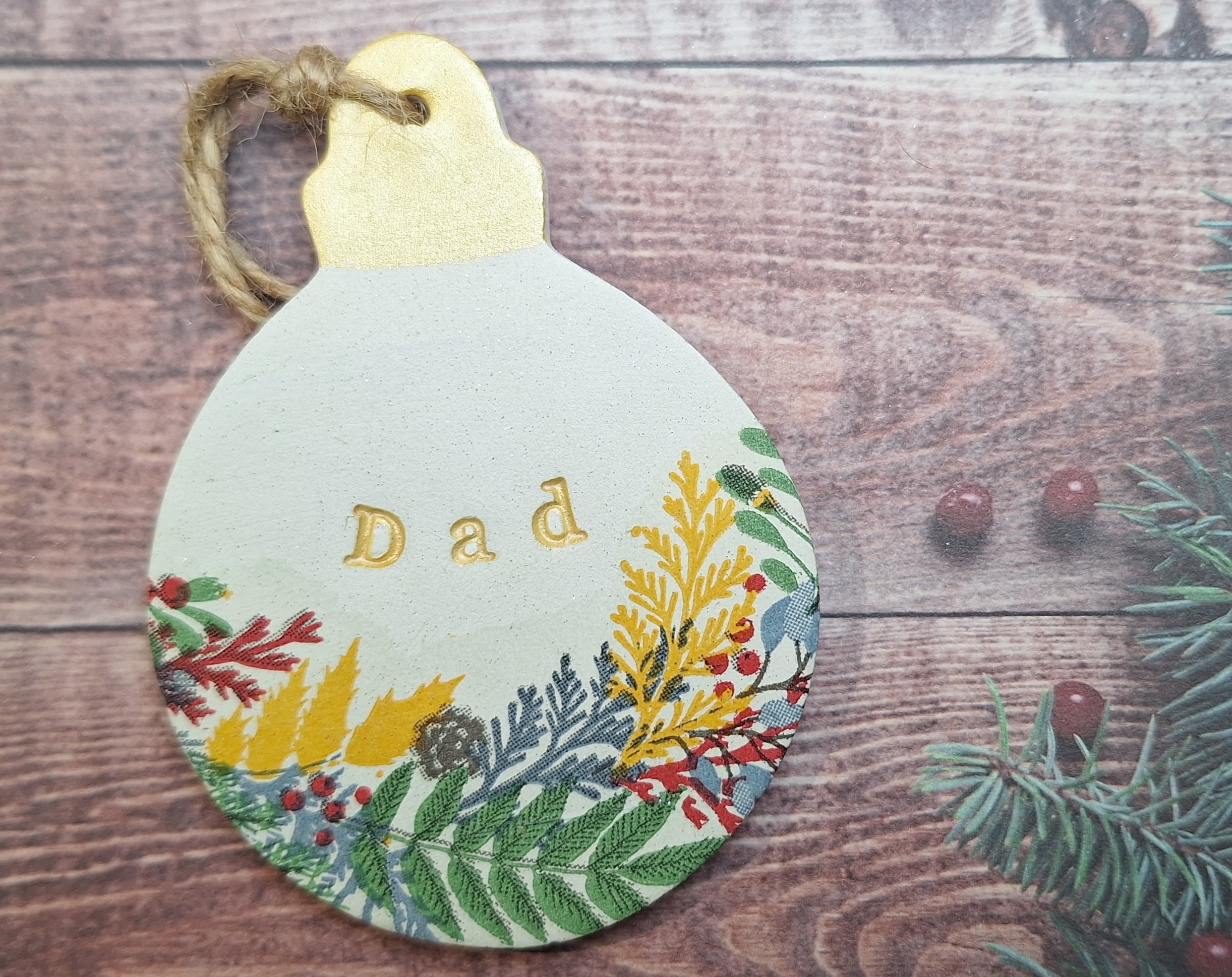 These gorgeous Christmas ornaments are brand new for 2025. Each one is handmade entirely from scratch using air-dry clay and beautifully decoupaged. The ornaments feature delicate hand-painted gold detailing for a festive, elegant touch.
Measuring approximately 8cm, these personalised baubles make perfect keepsakes for your Christmas tree or as thoughtful gifts for loved ones. When kept dry, they will last for many years, creating lasting memories and adding a unique charm to your holiday decorations.