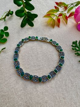 Elevate your elegance with our Green Onyx Marcasite Sterling Silver Bracelet from Silver Fountain, perfect as a gift for yourself or a loved one. Embrace the resurgence of vintage style with this meticulously crafted piece, featuring genuine green onyx believed to foster self-confidence and resilience. As an Ireland-based business, we pride ourselves on offering fast delivery to ensure your treasures arrive promptly. Discover the timeless allure of vintage charms and add a piece of history to your collection with this elegant bracelet.