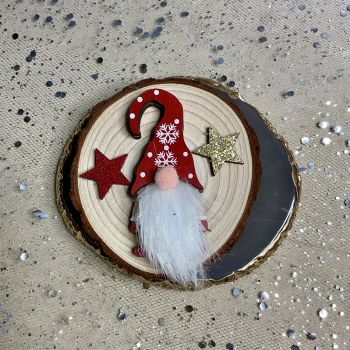 Wooden fridge magnets with Christmas decorations.