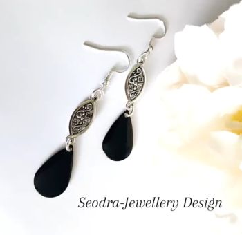 Handmade antique silver filigree earrings, with drops beautifully enamelled in glossy black. They are suspended from silver plated, nickel free ear wires, suitable for sensitive ears. Lightweight and easy to wear. Elevate your style with these bespoke beauties! They arrive in a pretty organza bag, and have free shipping