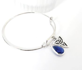 A beautiful polished stainless steel adjustable bracelet, with a gorgeous antique silver celtic charm and a sparkly silver framed faceted glass drop. Light, elegant and easy to wear. Elevate your style with this beautiful bespoke piece. It arrives in a pretty organza bag, and ... has free shipping!