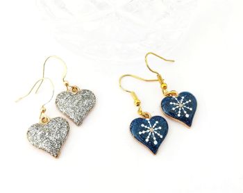 Two pairs of cute earrings with sparkly hearts in gorgeous silver, gold, white and deep blue, suspended from gold plated, nickel free ear hooks.&nbsp; Lightweight and easy to wear, great for Christmas parties/gifting/stocking fillers.... They arrive in a pretty organza bag, and have free shipping!