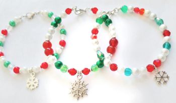 A set of three gorgeous handmade, silver plated childrens bracelets, created with sparkly festive beads in red, green and white, and a cute silver snowflake&hellip; a great little bracelet for Christmas stocking fillers! They arrive in a pretty organza bag, and have Free Shipping!