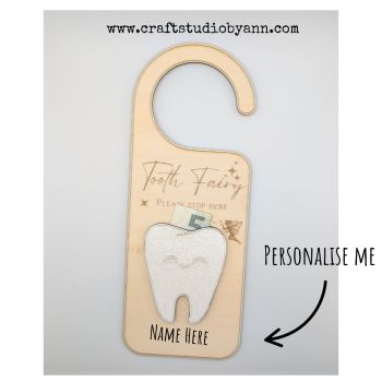 Make every lost tooth moment truly magical with this beautifully crafted Personalised Tooth Fairy Door Hanger. Lovingly laser‑cut from 3 mm natural basswood and smoothly engraved, it&rsquo;s the perfect combination of whimsy and keepsake charm&nbsp; .