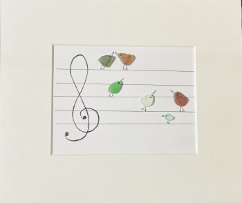 Musical birds sea glass art! Sea glass was hand picked &nbsp;from the beaches and rocks of Sandycove Co Dublin. Each piece is unique and handmade locally. Frames with glass fronts panel are sourced from Wicklow. Free postage in Ireland . Give a sustainable handmade Irish gift!