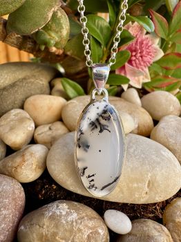 Dendritic Opal is a form of common Opal that has dark dendritic, tubular or orbicular markings within the base Opal, which can be composed of Manganese, the dendrites often appear to be shaped like mosses, ferns or trees
