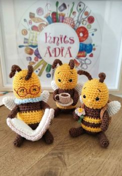 Bees with My beautiful Bees 🐝🐝🐝🐝 These are small crocheted bees, shown in various poses and with different accessories (reading a book, holding a cup, wearing a flower)! All three of them together are so sweet!