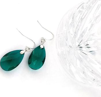Faceted glass drop earrings, in a beautiful deep green with silver accents. They are suspended from silver plated, nickel free ear hooks These earrings are light, elegant and comfortable to wear&hellip; Sparkle your way through this festive season with these beauties! They arrive in a pretty organza bag, and have free shipping!