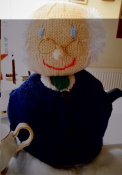 This handknitted teapot cosy is an adorable representation of the retired Michael D Higgins himself.
My teapot cosies are available in either navy blue or grey options. The cosies have Michael's blue eyes, and his distinguishable golden eye glasses and fuzzy hair.&nbsp;his&nbsp; is dark navy There is also the option of a green or red tie as chosen.&nbsp;
He will be ready for delivery in the New Year 2026 ONLY