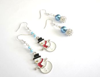 Handmade Christmas earrings, created with cute silver tone snowmen, enamelled in white, red and black, and gorgeous sparkly shamballa earrings, with beautiful pearlised beads in blue, both have silver plated beads and ear hooks... the ear hooks are nickel free and suitable for sensitive ears.&nbsp; Perfect for fun Christmas parties/gifts/stocking fillers.. Sparkle your way through the festive season with these cuties!&nbsp; They arrive in a pretty organza bag, and have free shipping!