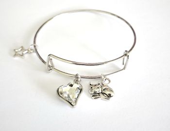 Cute charm bracelet in highly polished stainless steel, created with a framed faceted glass heart charm, a silver plated cat charm and an open silver plated star charm, a lovely lightweight adjustable bracelet, perfect for cat lovers... It arrives in a pretty organza bag, and has free shipping