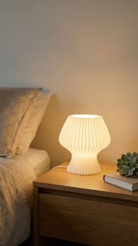 The Pleated Glow: Modern Sculptural LED Table Lamp
​Elevate your space with a perfect blend of geometric precision and warm, ambient light. Featuring a distinctive accordion-pleat silhouette, this lamp acts as a sculptural centerpiece whether it&rsquo;s illuminated or catching the daylight on your side table.
​Key Features

​Customizable Atmosphere: Tailor your environment with 3 distinct light warmth settings (Warm, Neutral, and Cool White) to suit everything from focused reading to a relaxed evening wind-down.
​Precision Dimming: Effortlessly find your comfort zone with multiple intensity levels, allowing you to transition from a soft nightlight to a vibrant task light.
​Diffused Elegance: The rhythmic, pleated shade is designed to catch and soften light, eliminating harsh glares and creating a uniform, cozy radiance across your room.
​Compact &amp; Statement-Making: With its unique "hourglass-pleat" footprint, it offers a bold visual impact without overcrowding your nightstand or desk.
