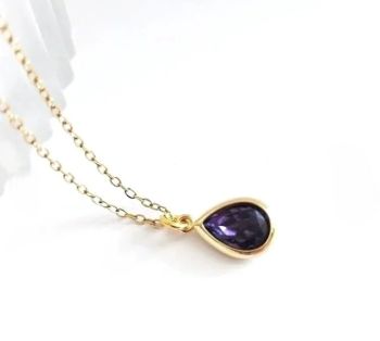A lovely, dainty necklace, created with a beautifully framed, faceted glass drop in deep purple. The pendant is suspended from a fine chain (stainless steel) in gold. The chain is approx. 45.7cm/ 18ins, plus extension chain (approx. 5cm/2ins). The pendant itself is approx. 1.27cm/0.05ins). This gorgeous pendant is perfect for all seasons/day/evening wear, so versatile! Elevate your style with this beautiful piece! It arrives in a pretty organza bag&hellip;. and has free shipping!