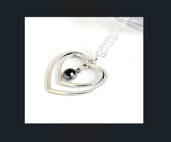 A beautiful necklace created with an antique silver tone double heart pendant, which has a deep emerald green glass bead centre piece. It&rsquo;s suspended from a silver plated ring, chain and clasp. The chain is approx. 45.75cm/18ins in length, plus extension chain (approx. 5cm/2ins in length). The heart pendant is approx. 2.5cm/0.9ins in length. A gorgeous pendant, suitable for every season&hellip;it&rsquo;s lightweight and comfortable to wear&hellip; It arrives in a pretty organza bag, and has free shipping