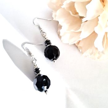 Handmade earrings, created in black and silver with beautiful faceted beads, hematite beads and silver plated beads and ear hooks ( the ear hooks are silver plated and nickel free, suitable for sensitive ears).&nbsp; &nbsp;Lightweight and easy to wear, stylish and bespoke... elevate your look with these beautiful earrings... They arrive in a pretty organza bag, and have free shipping