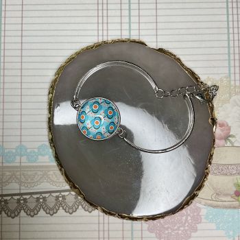 Stainless steel glass dome bracelet.