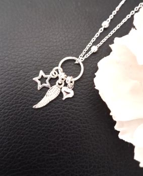 A gorgeous handmade pendant, created with mini silver plated angel wing, cushion heart and open star charms, silver plated beads, ring and chain. The chain length is approx. 45.7cm/18ins, it also has an extension chain (approx. 5cm/2ins).&nbsp; It arrives in a pretty organza bag, and has free shipping.
