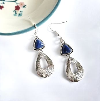 Beautiful boho earrings, created with silver plated open drops, antique silver tone connectors with a deep blue centre. The ear hooks are silver plated and nickel free,&nbsp; and suitable for sensitive ears. (The drop on these earrings is approx.4,25cm/1.67ins)&nbsp; Elevate your look with these gorgeous one of a kind earrings... They arrive in a pretty organza bag, and have free shipping.