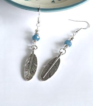 Handmade earrings, created with antique silver feather drops, silver plated beads and natural jade stones (dyed). The ear hooks are silver plated and nickel free.. suitable for sensitive ears.&nbsp; They are lightweight and comfortable to wear. The drop on these earrings is approx. 4cm/1.5ins.&nbsp; &nbsp;They arrive in a pretty organza bag, and have free shipping