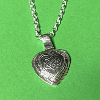 Silver pendant with Celtic heart
Necklaces are made to order, depending on length chosen.&nbsp;
I create with recycled silver. I use copper that has been recycled into wire or sheet metal. Any coins that I use have been circulated but are in good condition. I use different materials, but all are recycled.&nbsp;