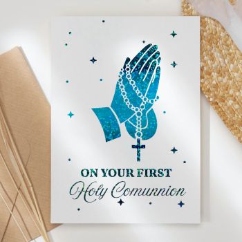 Celebrate this sacred milestone with our stunning First Holy Communion card, featuring beautiful praying hands with rosary beads in exquisite foil detailing that catches the light.

Unique &amp; High-Quality: Professionally printed on thick, premium paper for a standout look and feel
Symbolic Design: Features elegant praying hands adorned with rosary beads and a cross, representing faith, devotion, and prayer
The Perfect Fit: Available in A6 (10.5 cm x 14.8 cm / 4.1 in x 5.8 in) and A5 (14.8 cm x 21 cm / 5.8 in x 8.3 in) sizes - easy to mail and fits perfectly into standard envelopes
Your Personal Touch: Blank inside with plenty of room to write a personal, heartfelt message that makes this special day even more memorable
Handmade in Ireland: All our cards are made in Ireland, in our small home studio with care and attention to detail
Kraft Envelope Included: Each card comes with a beautiful kraft envelope


Available in stunning foil colours including gold, turquoise blue, rose gold, and silver. The sparkling foil finish creates a reverent, elegant look perfect for this holy occasion.