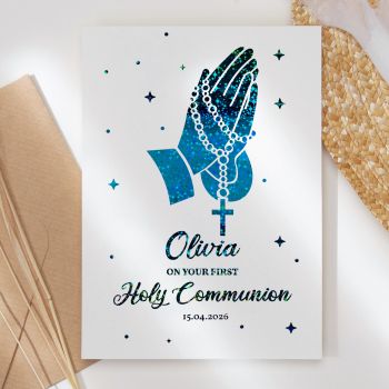 Make this sacred milestone truly unforgettable with our personalised First Holy Communion card, featuring beautiful praying hands with rosary beads in exquisite foil detailing that catches the light.

Fully Personalised: Customised with the child's name and communion date, making it a treasured keepsake they'll cherish forever
Unique &amp; High-Quality: This isn't your average card. It's professionally printed on thick, premium paper for a standout look and feel
Symbolic Design: Features elegant praying hands adorned with rosary beads and a cross, representing faith, devotion, and prayer
The Perfect Fit: Available in A6 (10.5 cm x 14.8 cm / 4.1 in x 5.8 in) and A5 (14.8 cm x 21 cm / 5.8 in x 8.3 in) sizes - easy to mail and fits perfectly into standard envelopes
Your Personal Touch: With a blank inside, you have plenty of room to write a personal, heartfelt message that makes this special day extra memorable
Support Small Business: Your purchase helps an independent creator, making it a gift that gives back. All our cards are made in Ireland, in our small home studio
Kraft Envelope Included: Each card comes with a beautiful kraft envelope


Available in stunning foil colours including turquoise blue, gold, rose gold, and silver. The sparkling foil finish creates a reverent, elegant look perfect for this holy occasion.