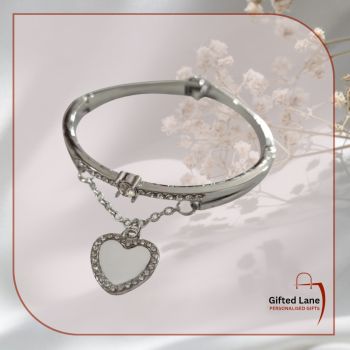 Personalised Diamond Bracelet is a personalised gift accessory for a occasion or a keepsake of a special day. It is a silver bracelet with heart diamond edging charm which can be personalised with a picture and with a date or name on it. Another special personalised gift from Gifted Lane