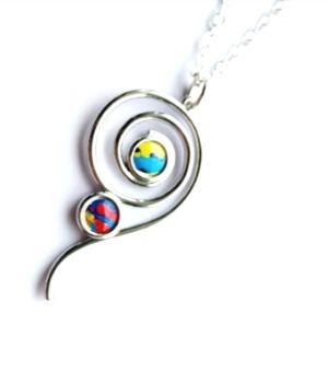A beautiful silver tone spiral pendant, accented with colourful beads in gorgeous shades of blue, yellow and red. It&rsquo;s suspended from a silver plated chain.. (chain length is approx. 45.7cm/18ins, plus extension chain, approx. 5cm/2ins). The pendant itself is approx. 3.8cm/1.5ins. Showcase your individual style with this gorgeous bespoke pendant! It arrives in a pretty organza bag, and&hellip; has free shipping! ... A perfect excuse to treat yourself!