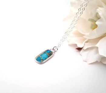 Beautiful, dainty pendant, made in Ireland with quality materials.&nbsp; A slender polished silver tone frame with a marbled centre in gorgeous shades of blue.&nbsp; Great for gifting or a treat for yourself!&nbsp; Dainty, elegant and lightweight.&nbsp; &nbsp;It arrives in a pretty organza bag.. and has free shipping!