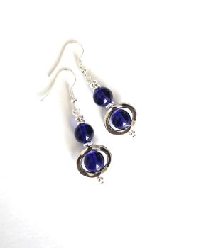 Beautiful drop earrings, handmade in Ireland with quality materials. Silver tone frames, glass beads in deep blue and silver plated beads and ear hooks. (nickel free ear hooks). Bespoke, lightweight and comfortable to wear. Great for both everyday wear and for evening... A lovely addition to any jewellery collection!&nbsp;&nbsp;Free shipping!