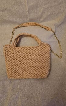 Crocheted handbag in cream/off white colour with gold chain detailing, using T-shirt/ribbon yarn.&nbsp;