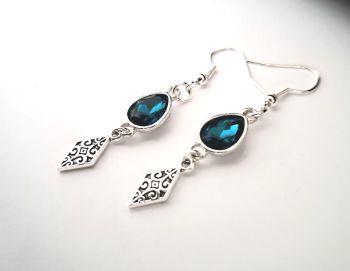 Beautiful earrings, made in Ireland with quality materials. Antique silver tone and faceted glass beads in petrol blue, suspended from silver plated, nickel free ear hooks.&nbsp; Elegant, light, easy to wear, and great for special occasions.&nbsp; Perfect for gifting, or for a personal treat!&nbsp;&nbsp;Free shipping!