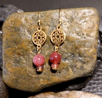Handmade earrings in Gold plated Sterling Silver. A 5mm Ruby bead and a small Pink Tourmaline bead drop from a small patterned circle.&nbsp; The total length of the drop is 22mm.