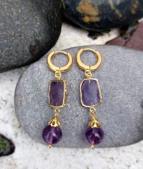 8mm grade A Amethyst beads drop from a rectangular set Amethyst stone.&nbsp; They drop from a strong hoop fitting. The earrings are handmade in gold plated Sterling Silver.&nbsp; The total length of the earrings is 55mm.